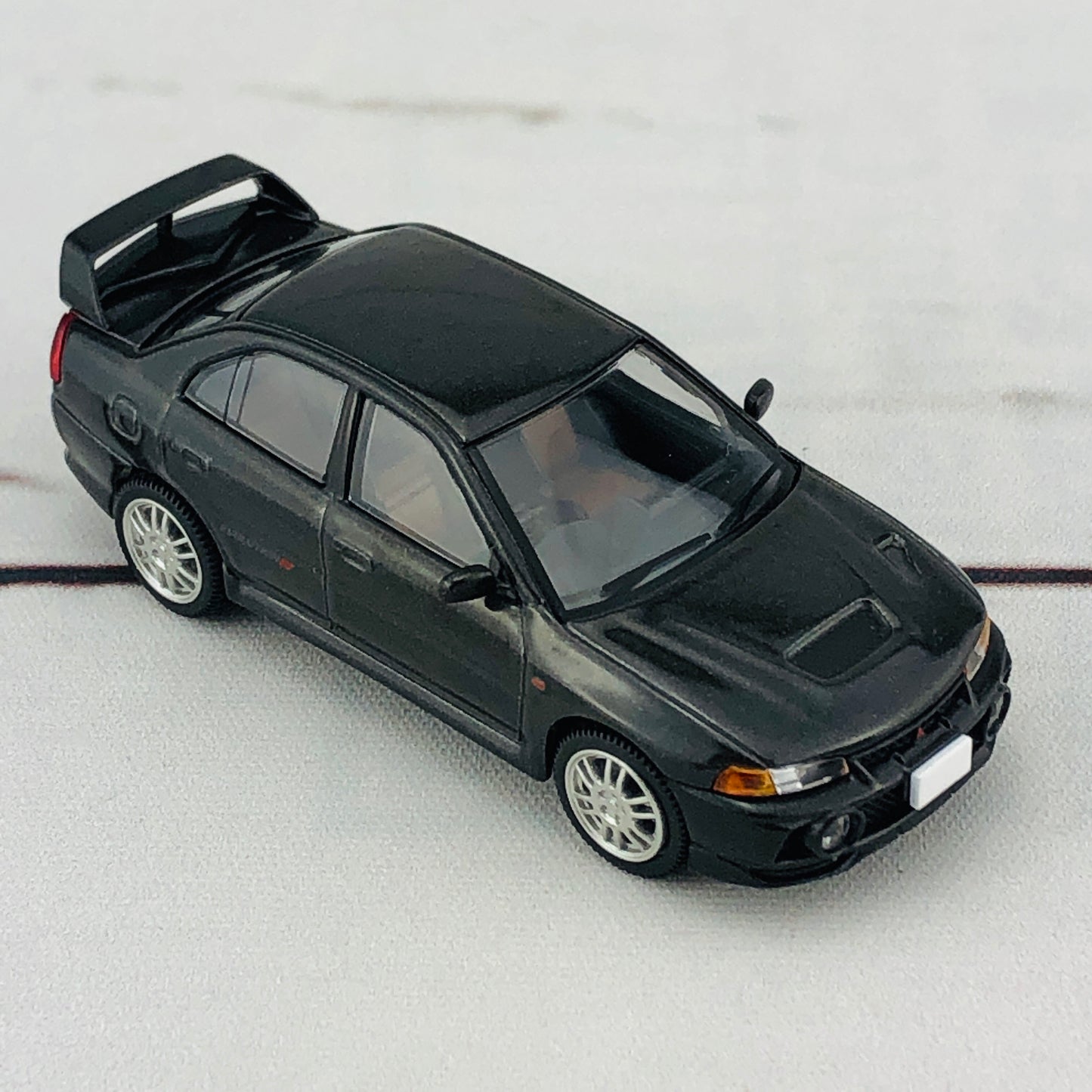Tomica Limited Vintage Neo Mitsubishi Lancer Evolution IV GSR Black (1996) LV-N186b