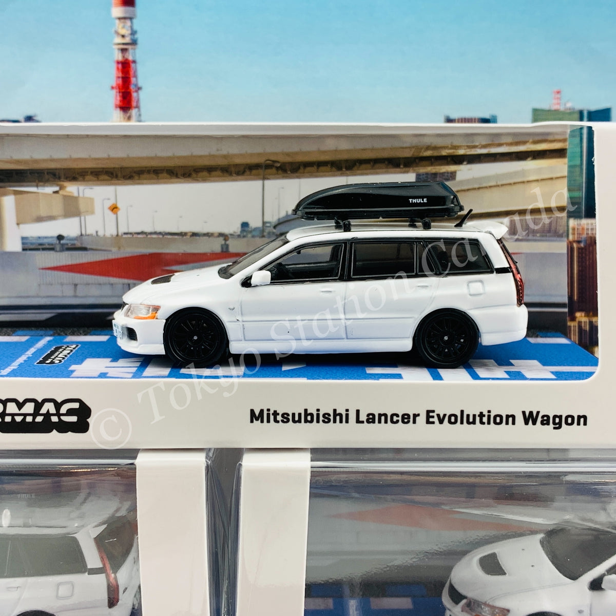 Tarmac Works 1:64 Mitsubishi Lancer Evolution Wagon (White) with Roof Box - M & J Toys Inc. Die-Cast Distribution | Specializing in Die-cast Collectibles Since 1987 Tarmac Works 1:64 Mitsubishi Lancer Evolution Wagon (White) with Roof Box - M & J Toys Inc. Die-Cast Distribution | Specializing in Die-cast Collectibles Since 1987