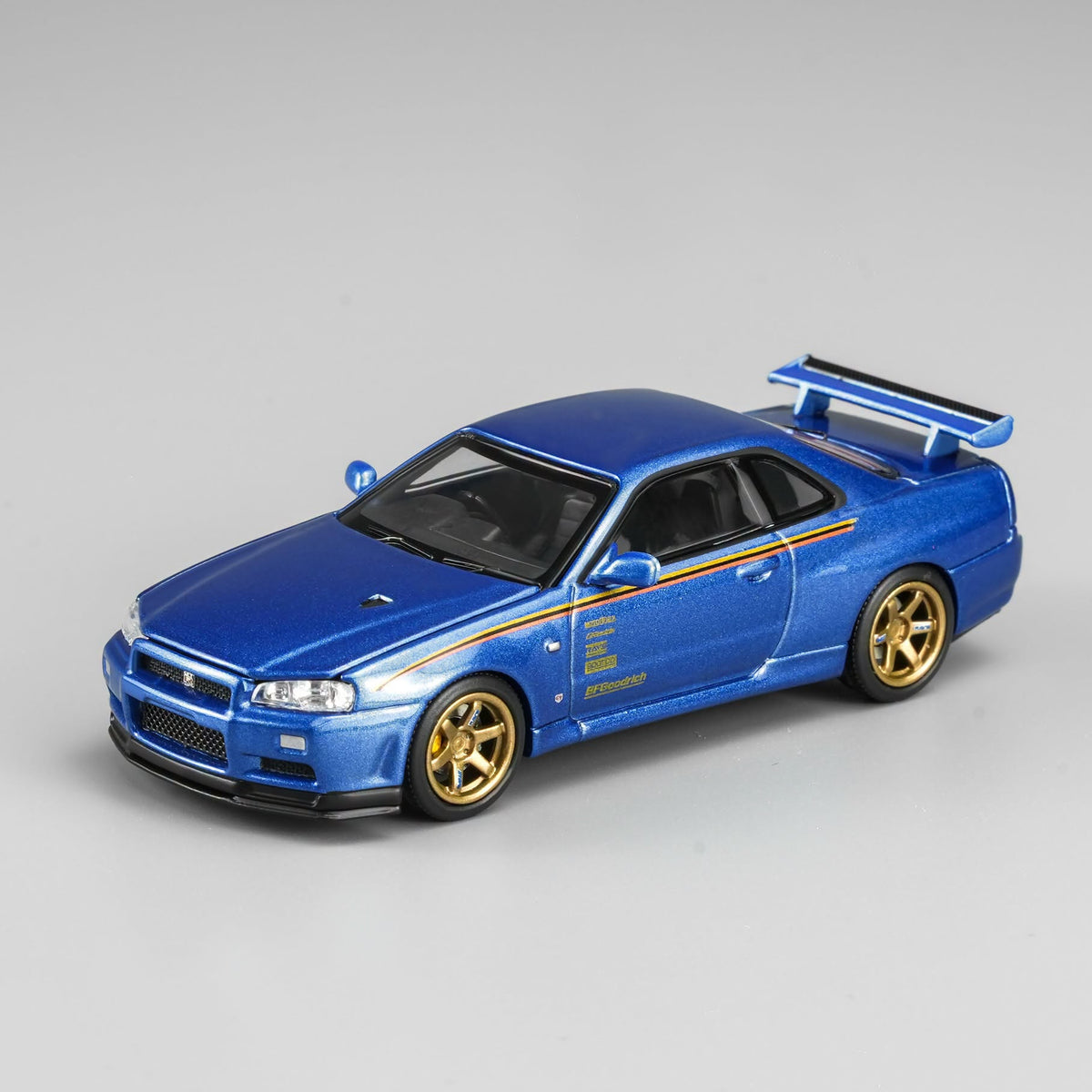 MOTORHELIX 1/64 Nissan Skyline GT‑R (R34) Customized Bayside Blue Hong Kong ToyCar Salon｜VDX Exclusive M63453DZ-PT