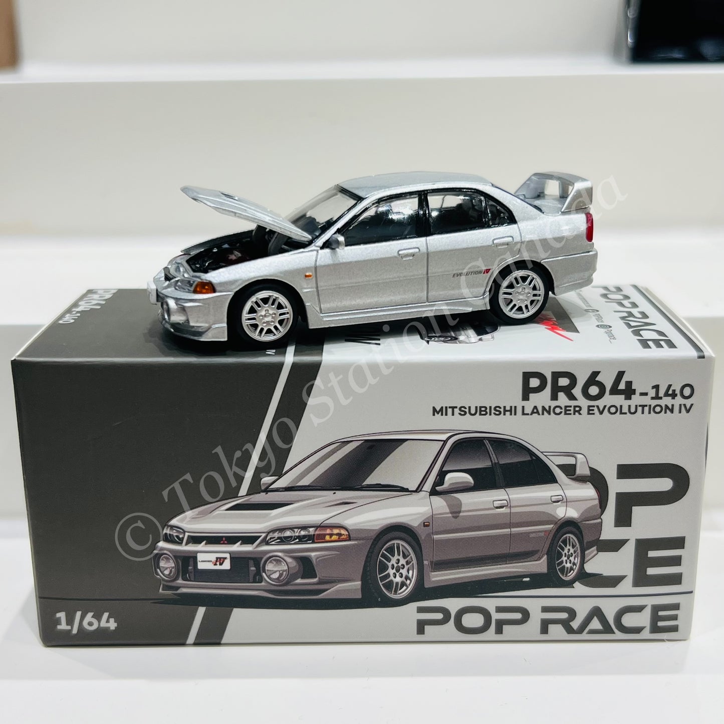 POPRACE 1/64 MITSUBISHI LANCER EVOLUTION IV - STEEL SILVER PR640140