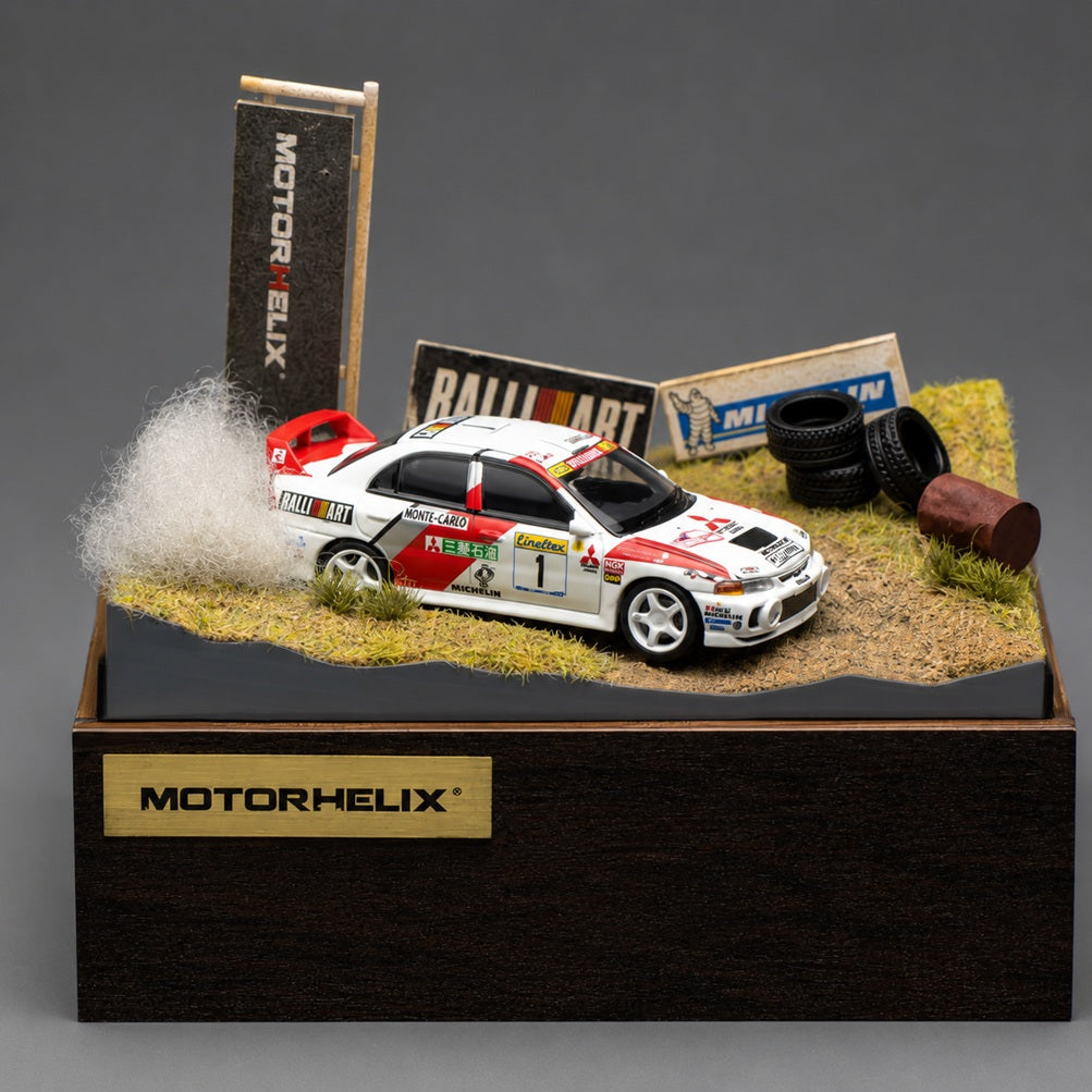 MOTORHELIX 1/64 Mitsubishi Lancer Evolution IV GSR Monte Carlo Livery with Rally Diorama Base 2026 HEC Exclusive Edition Limited to 299 PCS **Limited to ONE per customer**