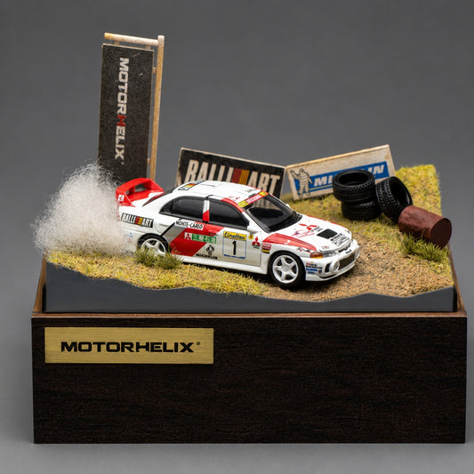 MOTORHELIX 1/64 Mitsubishi Lancer Evolution IV GSR Monte Carlo Livery with Rally Diorama Base 2026 HEC Exclusive Edition Limited to 299 PCS **Limited to ONE per customer**
