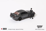 PREORDER MINI GT 1/64 Nissan Skyline GT-R (R32) Nismo Gunmetal w/ Matsuda Figure (Tsugio Matsuda Collection) MGT00869-R (Approx. Release Date : Q1 2025 subject to manufacturer's final decision)