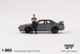 PREORDER MINI GT 1/64 Nissan Skyline GT-R (R32) Nismo Gunmetal w/ Matsuda Figure (Tsugio Matsuda Collection) MGT00869-R (Approx. Release Date : Q1 2025 subject to manufacturer's final decision)