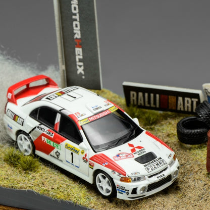 MOTORHELIX 1/64 Mitsubishi Lancer Evolution IV GSR Monte Carlo Livery with Rally Diorama Base 2026 HEC Exclusive Edition Limited to 299 PCS **Limited to ONE per customer**