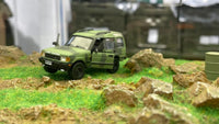 BM CREATIONS JUNIOR 1/64 Land Rover 1998 Discovery 1 Military Camouflage with Oil Tank (MG Edition) RHD 64B0195