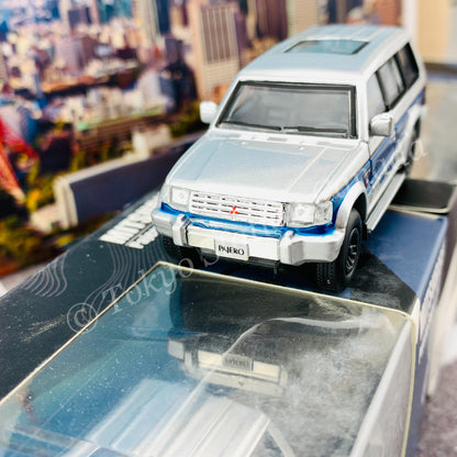 BM CREATIONS JUNIOR 1/64 Mitsubishi Pajero Super Exceed Silver with Blue Stripe LHD 64B0037
