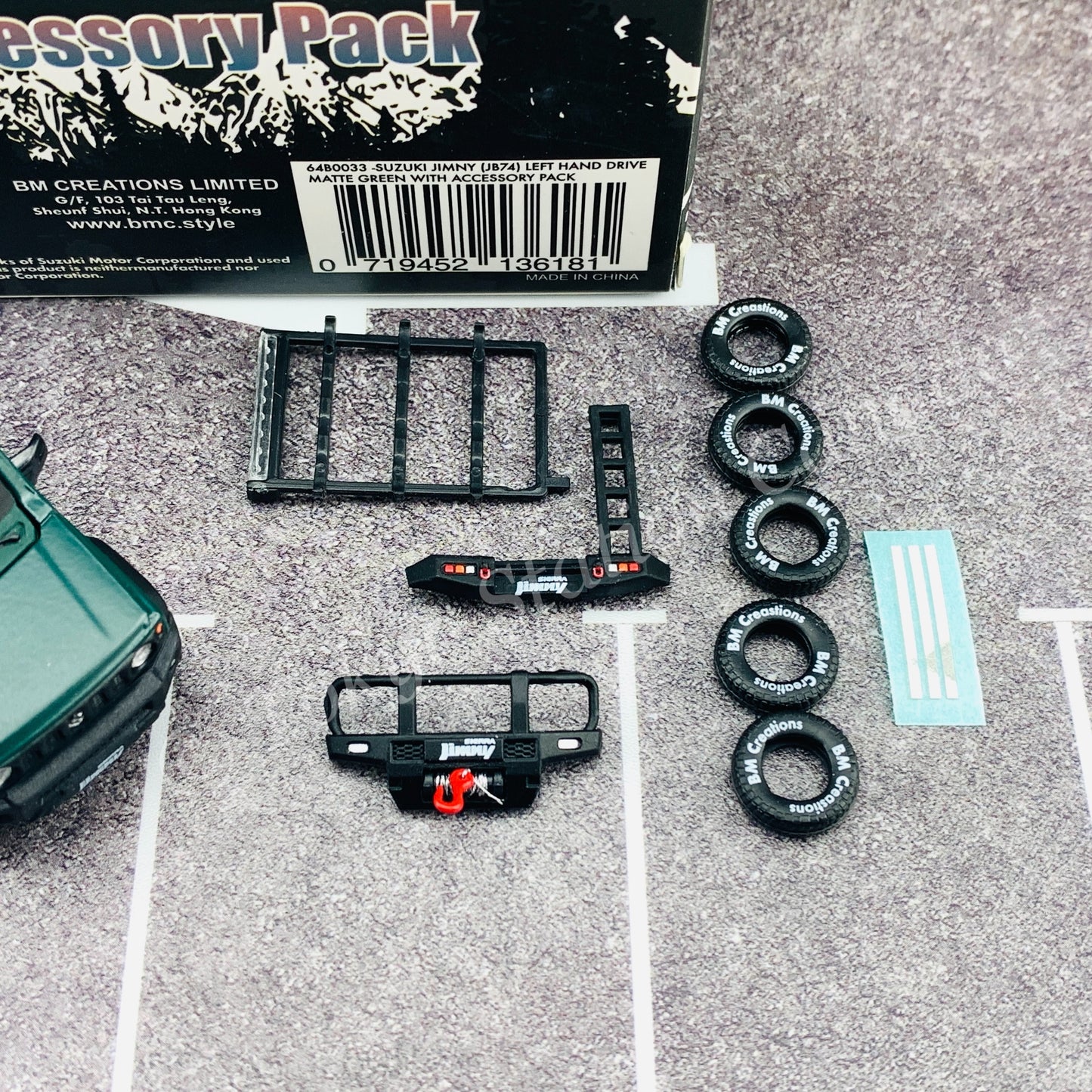 BM CREATIONS JUNIOR 1/64 Suzuki Jimny SIERRA JB74 with Accessory Pack Matt Green LHD 64B0033
