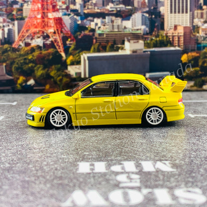 BM CREATIONS JUNIOR 1/64 Mitsubishi Lancer Evolution VII YELLOW RHD with Extra Wheel Set and Lowering Parts 64B0084