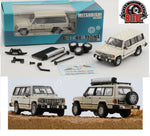 BM CREATIONS JUNIOR 1/64 Mitsubishi 1st Gen Pajero 1983 - Ivory w/stripe with Extra Wheels and Roof Rack LHD 64B0242