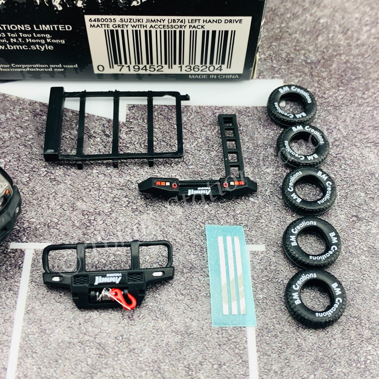 BM CREATIONS JUNIOR 1/64 Suzuki Jimny SIERRA JB74 with Accessory Pack Matt Grey LHD 64B0035
