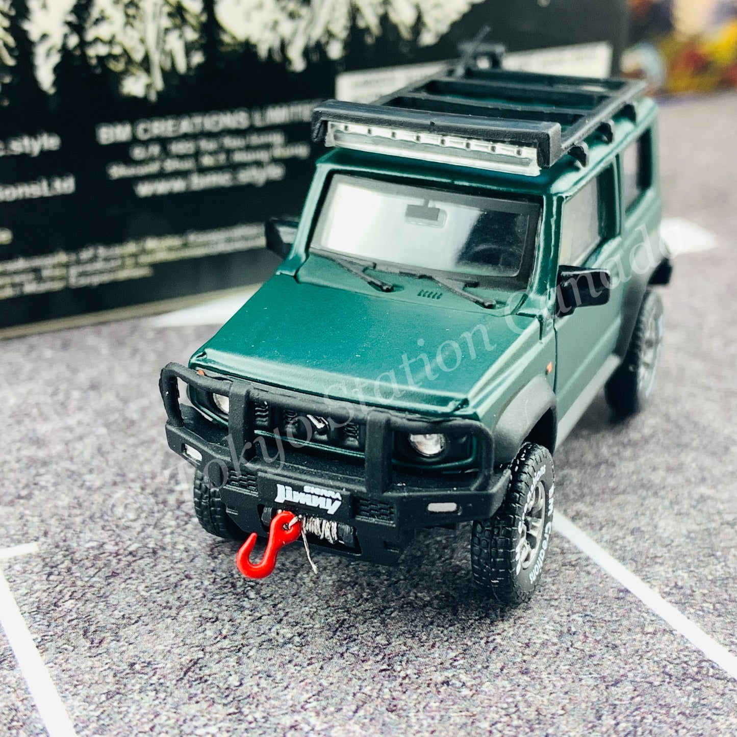 BM CREATIONS JUNIOR 1/64 Suzuki Jimny SIERRA JB74 with Accessory Pack Matt Green LHD 64B0033