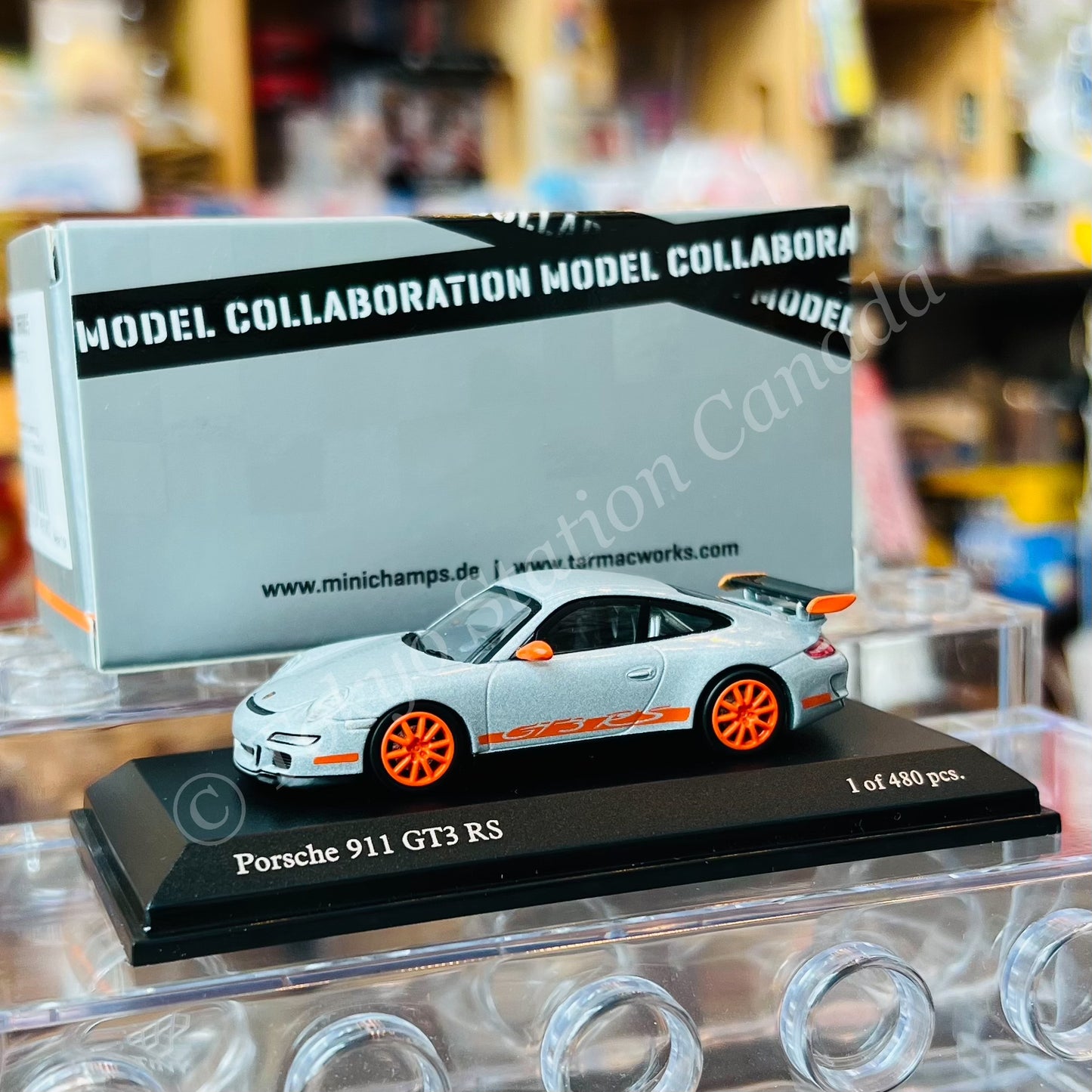 Tarmac Works x MINICHAMPS COLLAB64 1/64 Porsche 911 GT3 RS (997) Silver / Orange T64MC-001-SL (643066005)