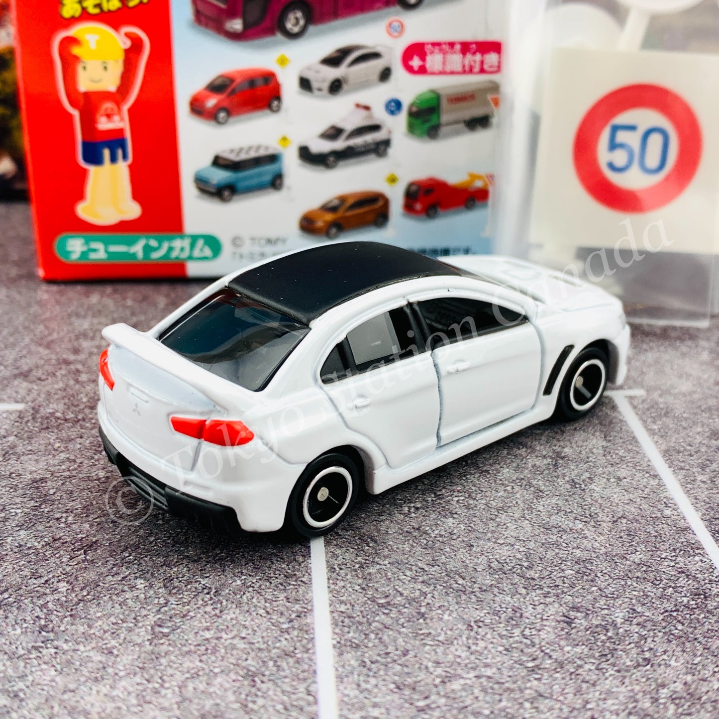 TAKARA TOMY A.R.T.S TOMICA Sign Set #4 - Mitsubishi Lancer Evolution X with a road sign stand