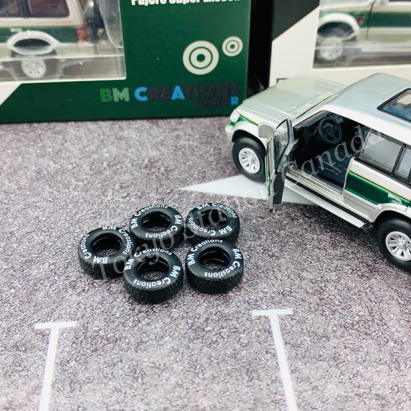 BM CREATIONS JUNIOR 1/64 Mitsubishi Pajero Super Exceed Silver with Green Stripe LHD 64B0020