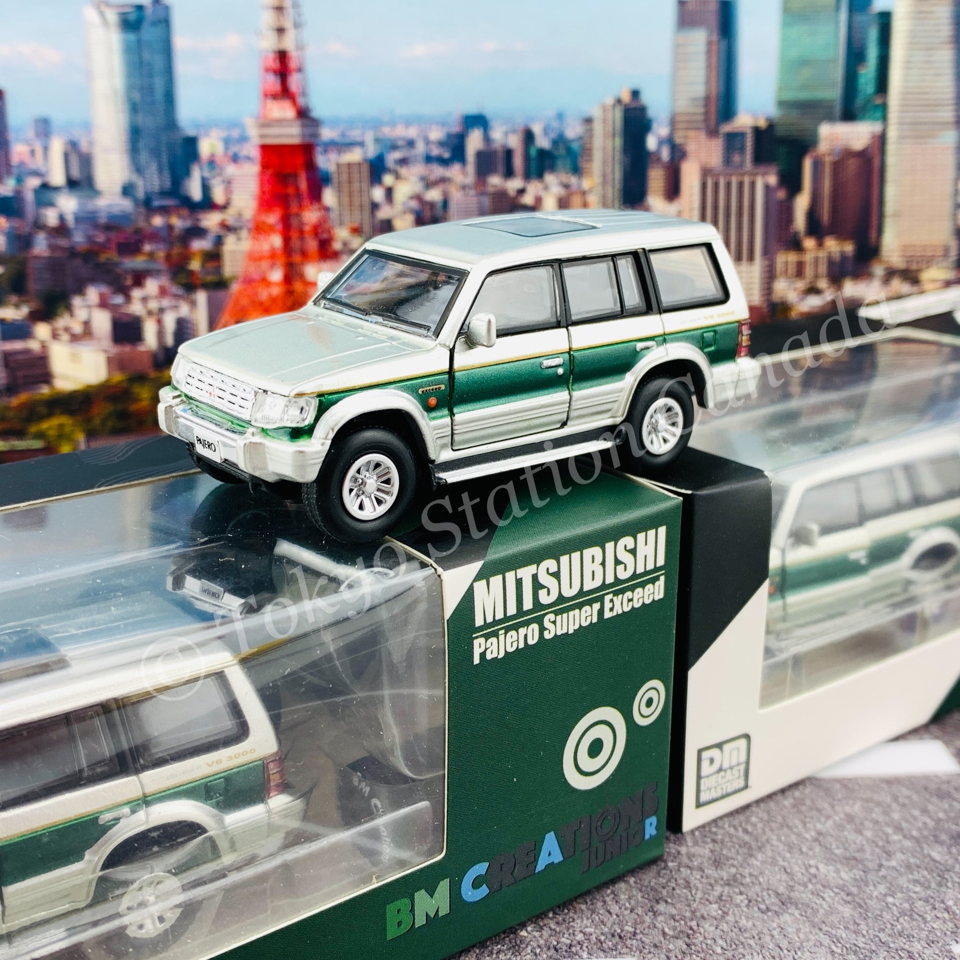 BM CREATIONS JUNIOR 1/64 Mitsubishi Pajero Super Exceed Silver with Green Stripe LHD 64B0020